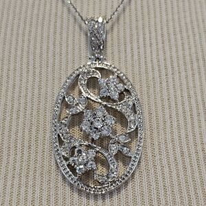 Sterling silver oval pendant w/ CZ flowers & leaves on sterling chain